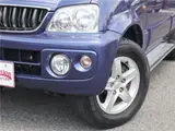 2004 Toyota Cami 1300Q / Side steps / Rear spoiler / Aluminum wheels / Spare spare tire / 4WD Blue Sedan for sale, Japanese used car export - photo 40 of 50 | GULJI TRADERS