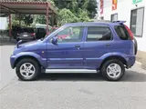2004 Toyota Cami 1300Q / Side steps / Rear spoiler / Aluminum wheels / Spare spare tire / 4WD Blue Sedan for sale, Japanese used car export - photo 45 of 50 | GULJI TRADERS