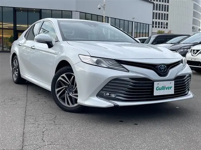 2019 Toyota Camry G 4WD - photo 1 2019 Toyota Camry G 4WD White Sedan for sale, Japanese used car export - photo 1 of 23 | GULJI TRADERS