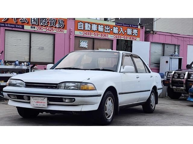 1990 Toyota Carina SE Extra - photo 1 1990 Toyota Carina SE Extra White Sedan for sale, Japanese used car export | GULJI TRADING