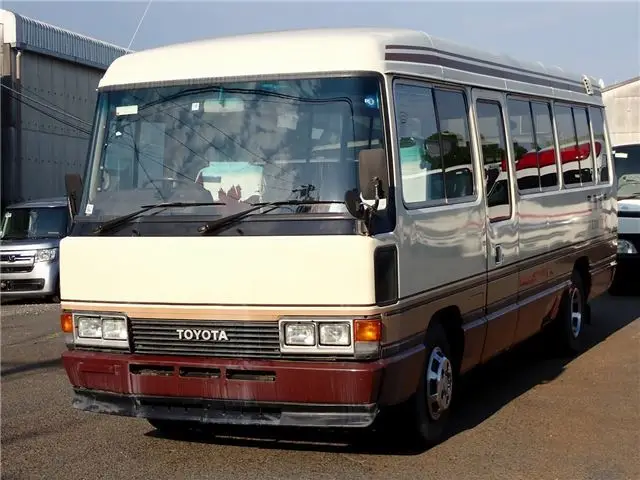1986 Toyota Coaster Long EX Turbo 29-seater - photo 1 1986 Toyota Coaster Long EX Turbo 29-seater White Van for sale, Japanese used car export - photo 1 of 80 | GULJI TRADERS