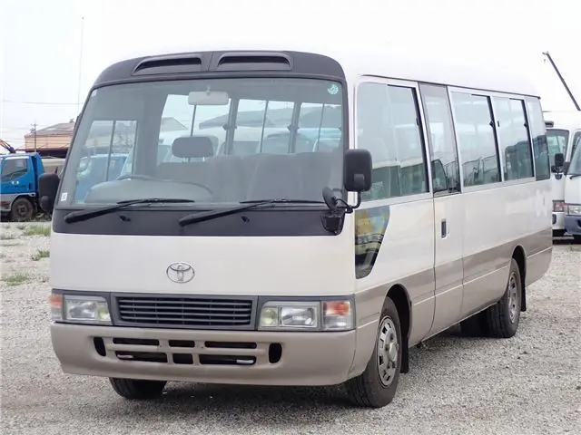 1995 Toyota Coaster Long GX - 29-seater - photo 1 1995 Toyota Coaster Long GX - 29-seater White Van for sale, Japanese used car export - photo 1 of 80 | GULJI TRADERS