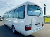 2014 Toyota Coaster Long LX 29-seater White Van for sale, Japanese used car export - photo 2 of 35 | GULJI TRADERS