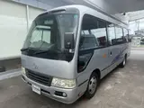 2014 Toyota Coaster 29-seater GX Long with automatic doors, reclining seats, non-smoking vehicle. Silver Van for sale, Japanese used car export - photo 1 of 35 | GULJI TRADERS