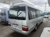 2014 Toyota Coaster 29-seater GX Long with automatic doors, reclining seats, non-smoking vehicle. Silver Van for sale, Japanese used car export - photo 2 of 35 | GULJI TRADERS