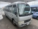 2014 Toyota Coaster 29-seater GX Long with automatic doors, reclining seats, non-smoking vehicle. Silver Van for sale, Japanese used car export - photo 4 of 35 | GULJI TRADERS