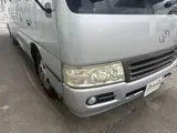 2014 Toyota Coaster 29-seater GX Long with automatic doors, reclining seats, non-smoking vehicle. Silver Van for sale, Japanese used car export - photo 8 of 35 | GULJI TRADERS