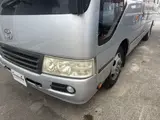 2014 Toyota Coaster 29-seater GX Long with automatic doors, reclining seats, non-smoking vehicle. Silver Van for sale, Japanese used car export - photo 9 of 35 | GULJI TRADERS