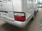 2014 Toyota Coaster 29-seater GX Long with automatic doors, reclining seats, non-smoking vehicle. Silver Van for sale, Japanese used car export - photo 11 of 35 | GULJI TRADERS