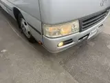 2014 Toyota Coaster 29-seater GX Long with automatic doors, reclining seats, non-smoking vehicle. Silver Van for sale, Japanese used car export - photo 22 of 35 | GULJI TRADERS