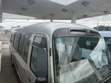 2014 Toyota Coaster 29-seater GX Long with automatic doors, reclining seats, non-smoking vehicle. Silver Van for sale, Japanese used car export - photo 23 of 35 | GULJI TRADERS