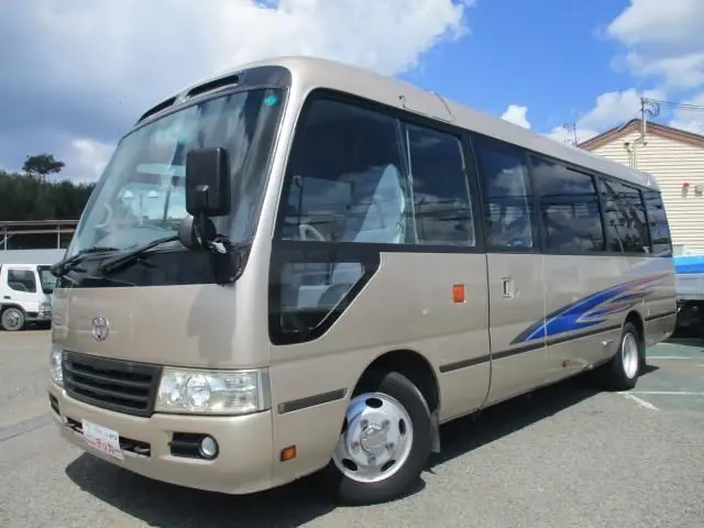 2014 Toyota Coaster 29-seater minibus, sightseeing specifications. Gold Van for sale, Japanese used car export - photo 1 of 9 | GULJI TRADERS