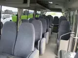 2014 Toyota Coaster 29-seater minibus, sightseeing specifications. Gold Van for sale, Japanese used car export - photo 6 of 9 | GULJI TRADERS