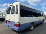 2015 Toyota Coaster Big Bang Long 9-seater with automatic doors White Van for sale, Japanese used car export - photo 2 of 47 | GULJI TRADERS