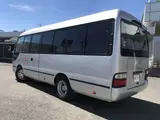 2015 Toyota Coaster Gifu Prefecture, 26-seater, minibus, electric side steps, 5-speed manual transmission. Silver Van for sale, Japanese used car export - photo 4 of 63 | GULJI TRADERS