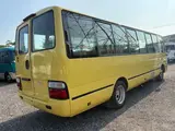 2015 Toyota Coaster Turbo car for toddlers Yellow Van for sale, Japanese used car export - photo 7 of 9 | GULJI TRADERS
