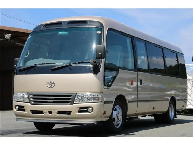 2016 Toyota Coaster Microbus EX Turbo Long, 29-seater Gold Van for sale, Japanese used car export - photo 1 of 62 | GULJI TRADERS