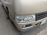 2016 Toyota Coaster 29-seater EX with automatic doors, passenger seat monitors, and refrigerators. Gold Van for sale, Japanese used car export - photo 8 of 30 | GULJI TRADERS