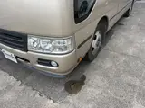 2016 Toyota Coaster 29-seater EX with automatic doors, passenger seat monitors, and refrigerators. Gold Van for sale, Japanese used car export - photo 9 of 30 | GULJI TRADERS
