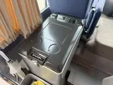 2016 Toyota Coaster 29-seater EX with automatic doors, passenger seat monitors, and refrigerators. Gold Van for sale, Japanese used car export - photo 18 of 30 | GULJI TRADERS