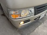 2016 Toyota Coaster 29-seater EX with automatic doors, passenger seat monitors, and refrigerators. Gold Van for sale, Japanese used car export - photo 19 of 30 | GULJI TRADERS
