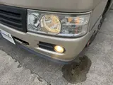 2016 Toyota Coaster 29-seater EX with automatic doors, passenger seat monitors, and refrigerators. Gold Van for sale, Japanese used car export - photo 21 of 30 | GULJI TRADERS