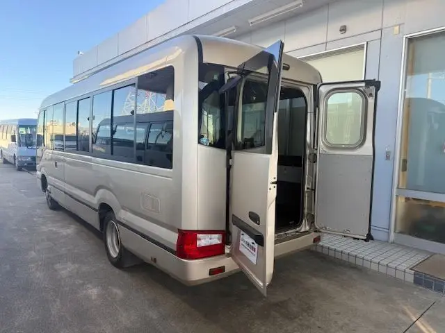 2017 Toyota Coaster 24-seater EX long rear double door AT automatic door RikuH leather seats Gold Van for sale, Japanese used car export - photo 1 of 38 | GULJI TRADERS