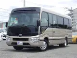 2017 Toyota Coaster EX Microbus, 28-seater, automatic doors, automatic transmission, navigation system, backup camera Brown Van for sale, Japanese used car export - photo 1 of 51 | GULJI TRADERS