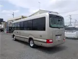 2017 Toyota Coaster EX Microbus, 28-seater, automatic doors, automatic transmission, navigation system, backup camera Brown Van for sale, Japanese used car export - photo 2 of 51 | GULJI TRADERS