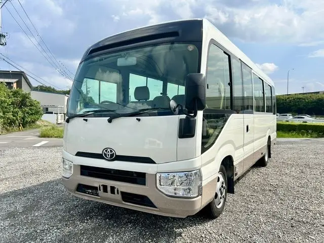 2017 Toyota Coaster LX Turbo 29-seater White Van for sale, Japanese used car export - photo 1 of 31 | GULJI TRADERS