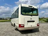 2017 Toyota Coaster LX Turbo 29-seater White Van for sale, Japanese used car export - photo 7 of 31 | GULJI TRADERS