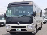 2018 Toyota Coaster EX 29 people, automatic doors Brown Van for sale, Japanese used car export - photo 1 of 40 | GULJI TRADERS
