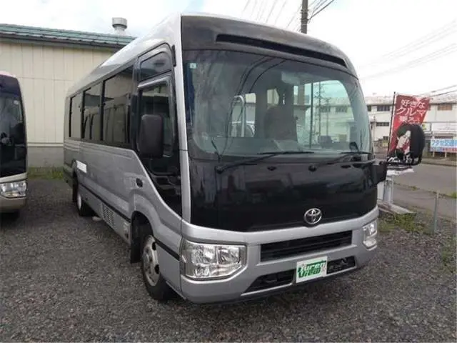 2018 Toyota Coaster Long GX Turbo - photo 1 2018 Toyota Coaster Long GX Turbo Gray Van for sale, Japanese used car export - photo 1 of 26 | GULJI TRADERS
