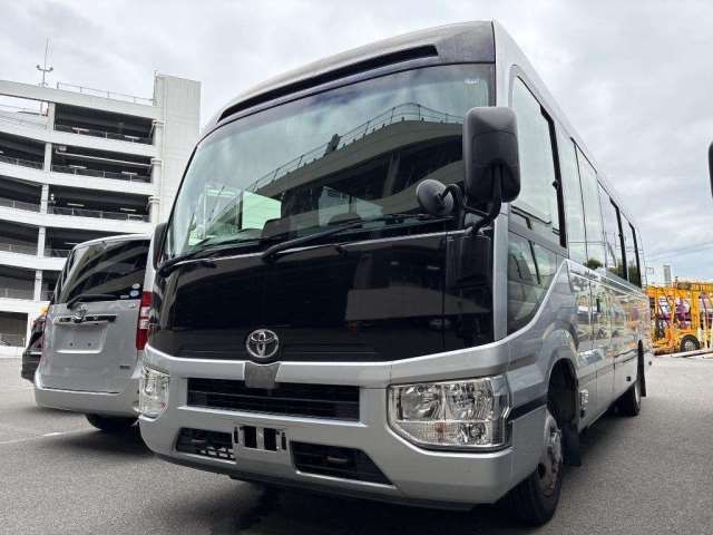 2018 Toyota Coaster GX - photo 1 2018 Toyota Coaster GX Sedan for sale, Japanese used car export - photo 1 of 7 | GULJI TRADERS