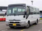 2019 Toyota Coaster Microbus LX Long, 24-seater, rear double doors, automatic doors, automatic transmission. White Van for sale, Japanese used car export - photo 1 of 51 | GULJI TRADERS