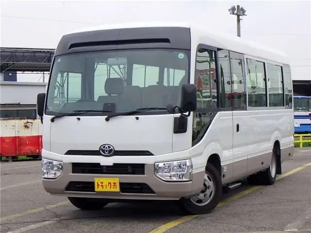 2019 Toyota Coaster Microbus LX Long, 24-seater, rear double doors, automatic doors, automatic transmission. White Van for sale, Japanese used car export - photo 1 of 51 | GULJI TRADERS
