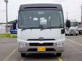 2019 Toyota Coaster Microbus LX Long, 24-seater, rear double doors, automatic doors, automatic transmission. White Van for sale, Japanese used car export - photo 2 of 51 | GULJI TRADERS