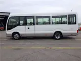 2019 Toyota Coaster Microbus LX Long, 24-seater, rear double doors, automatic doors, automatic transmission. White Van for sale, Japanese used car export - photo 3 of 51 | GULJI TRADERS