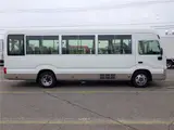 2019 Toyota Coaster Microbus LX Long, 24-seater, rear double doors, automatic doors, automatic transmission. White Van for sale, Japanese used car export - photo 4 of 51 | GULJI TRADERS