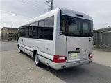 2019 Toyota Coaster GX 24-seater, double doors, cold weather specifications, auto-glide doors Silver Van for sale, Japanese used car export - photo 5 of 55 | GULJI TRADERS