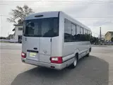 2019 Toyota Coaster GX 24-seater, double doors, cold weather specifications, auto-glide doors Silver Van for sale, Japanese used car export - photo 7 of 55 | GULJI TRADERS