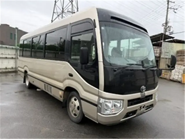 2019 Toyota Coaster EX Rear seat monitor refrigerator Gold Van for sale, Japanese used car export | GULJI TRADERS