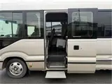 2019 Toyota Coaster EX Rear seat monitor refrigerator Gold Van for sale, Japanese used car export - photo 5 of 8 | GULJI TRADERS