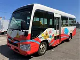 2020 Toyota Coaster Toddler bus, long type, 3+49/1.5 passenger capacity White Van for sale, Japanese used car export - photo 1 of 60 | GULJI TRADERS