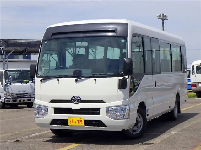 2020 Toyota Coaster Microbus LX Long 29-seater with automatic swing doors, collision mitigation, and automatic transmission. - photo 1 2020 Toyota Coaster Microbus LX Long 29-seater with automatic swing doors, collision mitigation, and automatic transmission. White Van for sale, Japanese used car export - photo 1 of 51 | GULJI TRADERS
