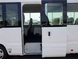 2020 Toyota Coaster Microbus LX Long 29-seater with automatic swing doors, collision mitigation, and automatic transmission. White Van for sale, Japanese used car export - photo 7 of 51 | GULJI TRADERS