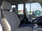 2020 Toyota Coaster Microbus LX Long 29-seater with automatic swing doors, collision mitigation, and automatic transmission. White Van for sale, Japanese used car export - photo 36 of 51 | GULJI TRADERS