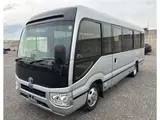 2021 Toyota Coaster GX 29 people Silver Van for sale, Japanese used car export - photo 1 of 3 | GULJI TRADERS