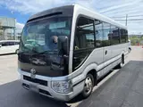 2021 Toyota Coaster GX Silver Van for sale, Japanese used car export - photo 1 of 2 | GULJI TRADERS