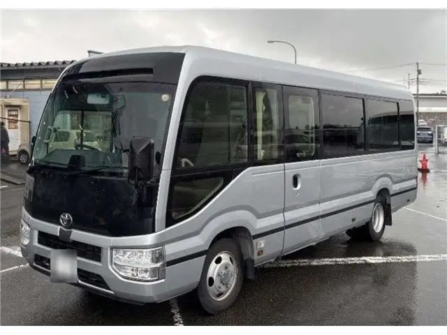 2023 Toyota Coaster GX - photo 1 2023 Toyota Coaster GX Silver Van for sale, Japanese used car export - photo 1 of 4 | GULJI TRADERS